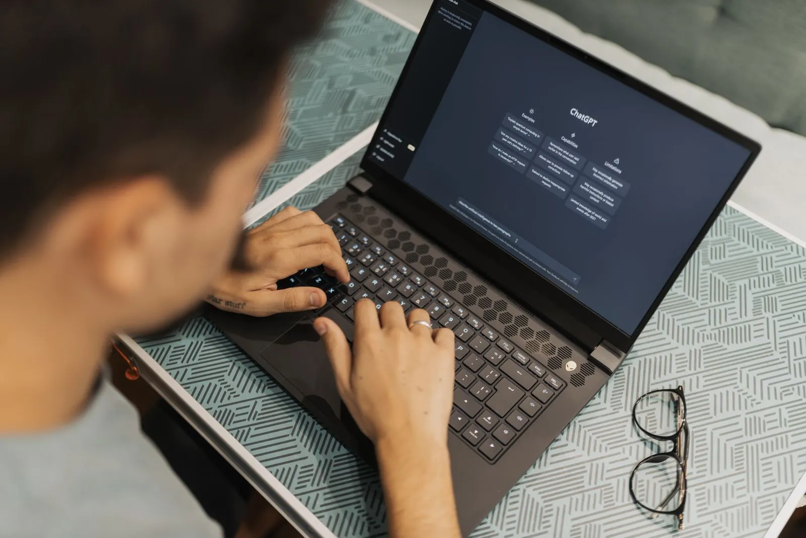A person working with ChatGPT on a laptop
